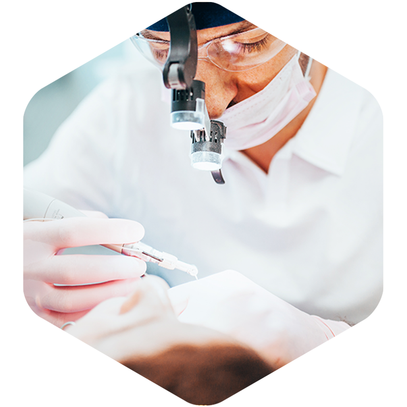 Dentist working on root canal procedure